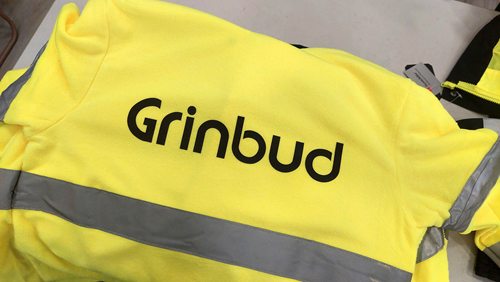 Żółta odzież ostrzegawcza z nadrukiem Grinbud na plecach